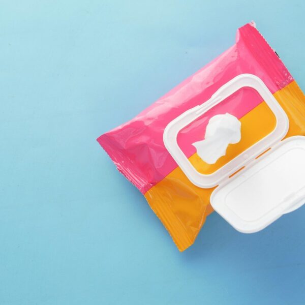 a pink and yellow bag of food on a blue surface